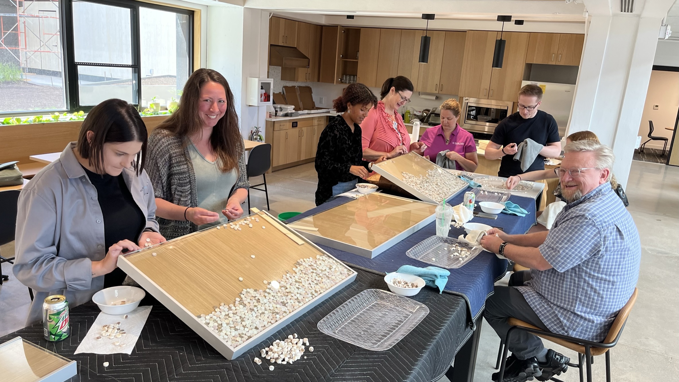 Creating the pearl button blanks back splash in the kitchen. (NM photo) 2024/07/NM-building-LBC-web2.jpeg 