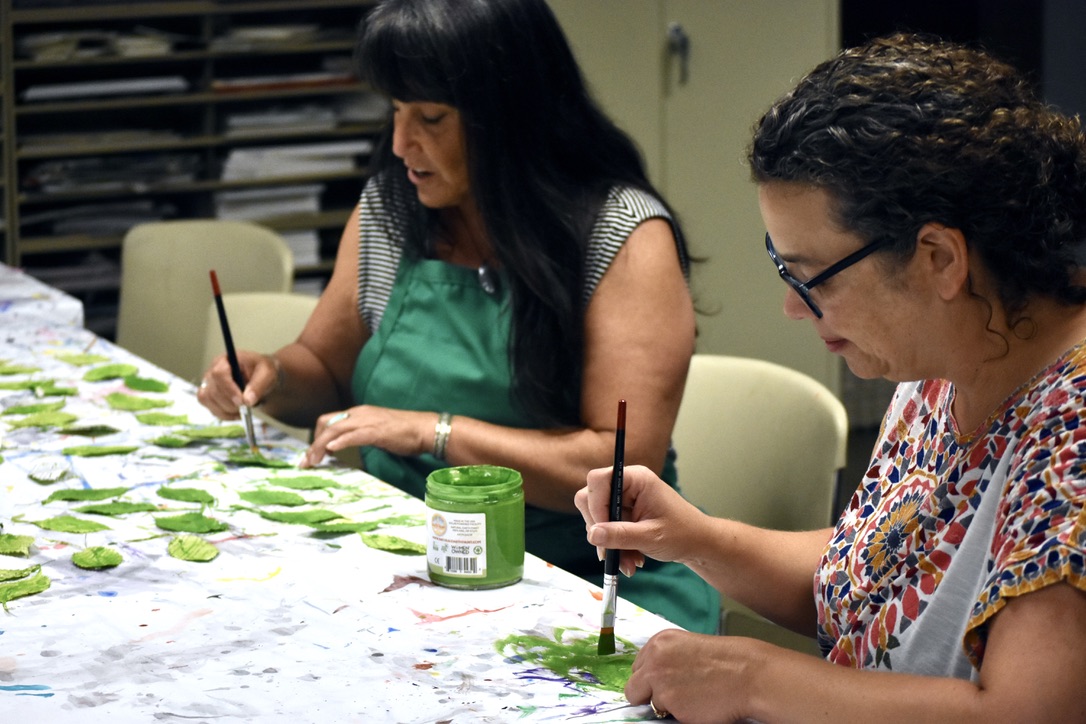 Painting leaves for the Tree of Accountablity. (SC photo) 2024/07/NM-building-LBC-web3.jpeg 