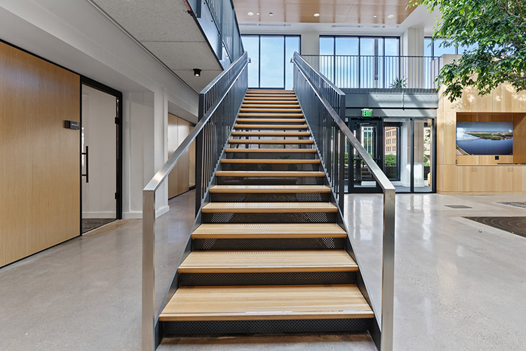 One of two stairways that lead to the second floor. The material from the previous stairways were used in the construction of the Tree of Accountability. (Clay Whisler photo) 2024/07/stanley-center-2024-097-CW-750x500-1.jpg 